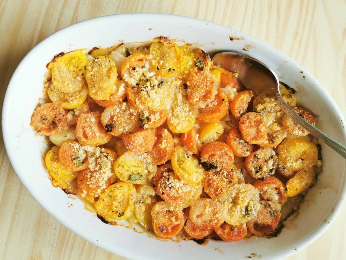 Roasted cherry tomatoes in a baking dish