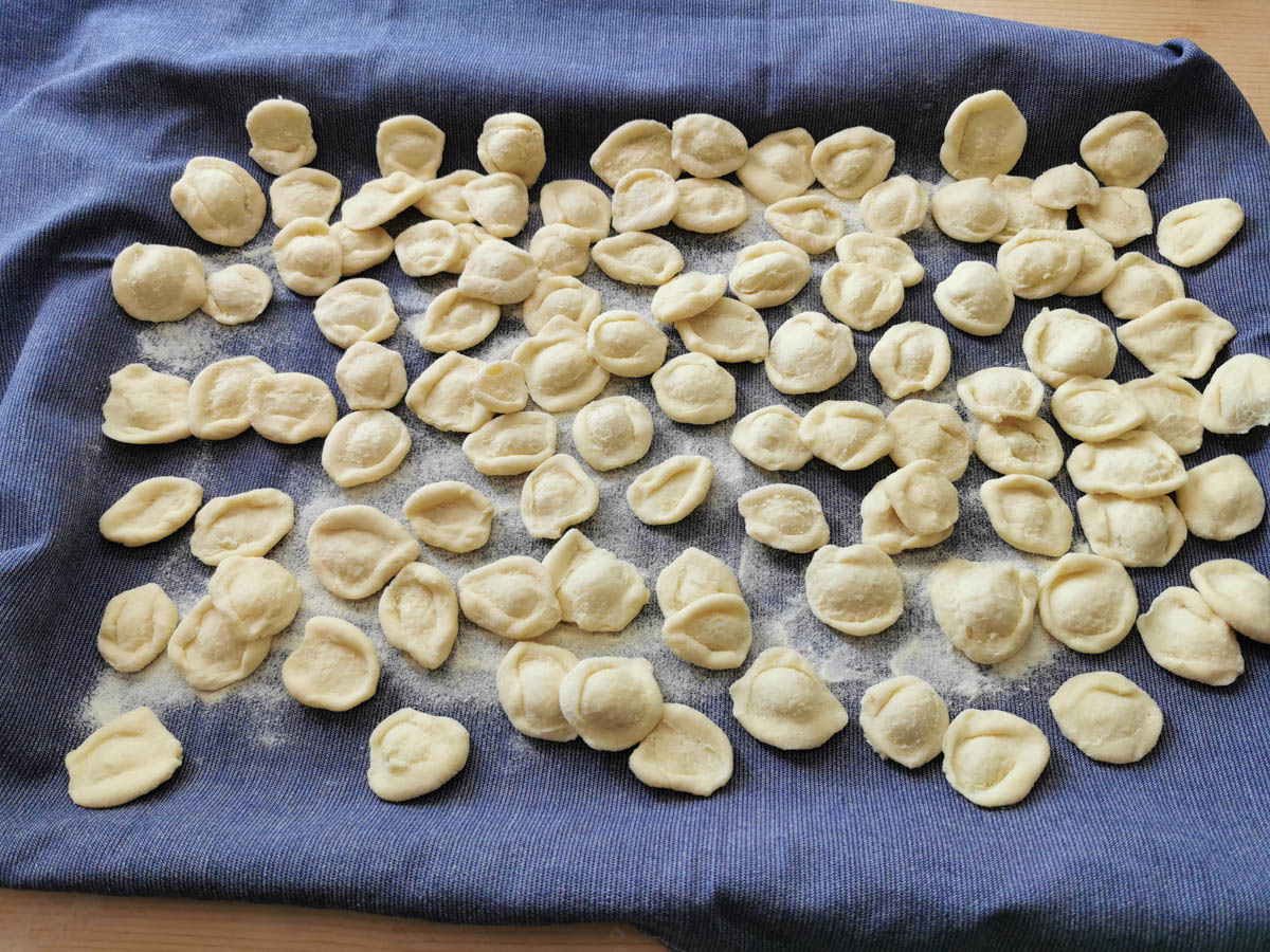 Homemade orecchiette on a tray.