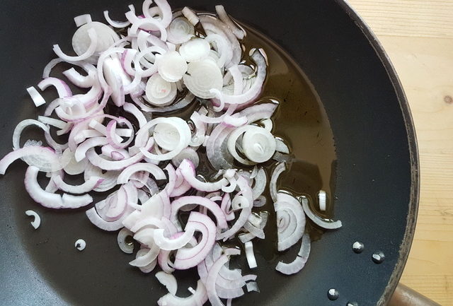 onions with olive oil in skillet