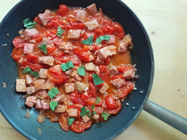 cooked fresh tuna ragu with mint leaves in skillet