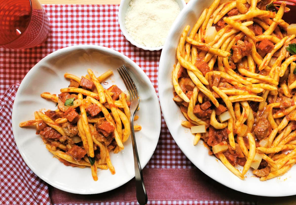 Italian spicy sausage pasta served with grated pecorino. 