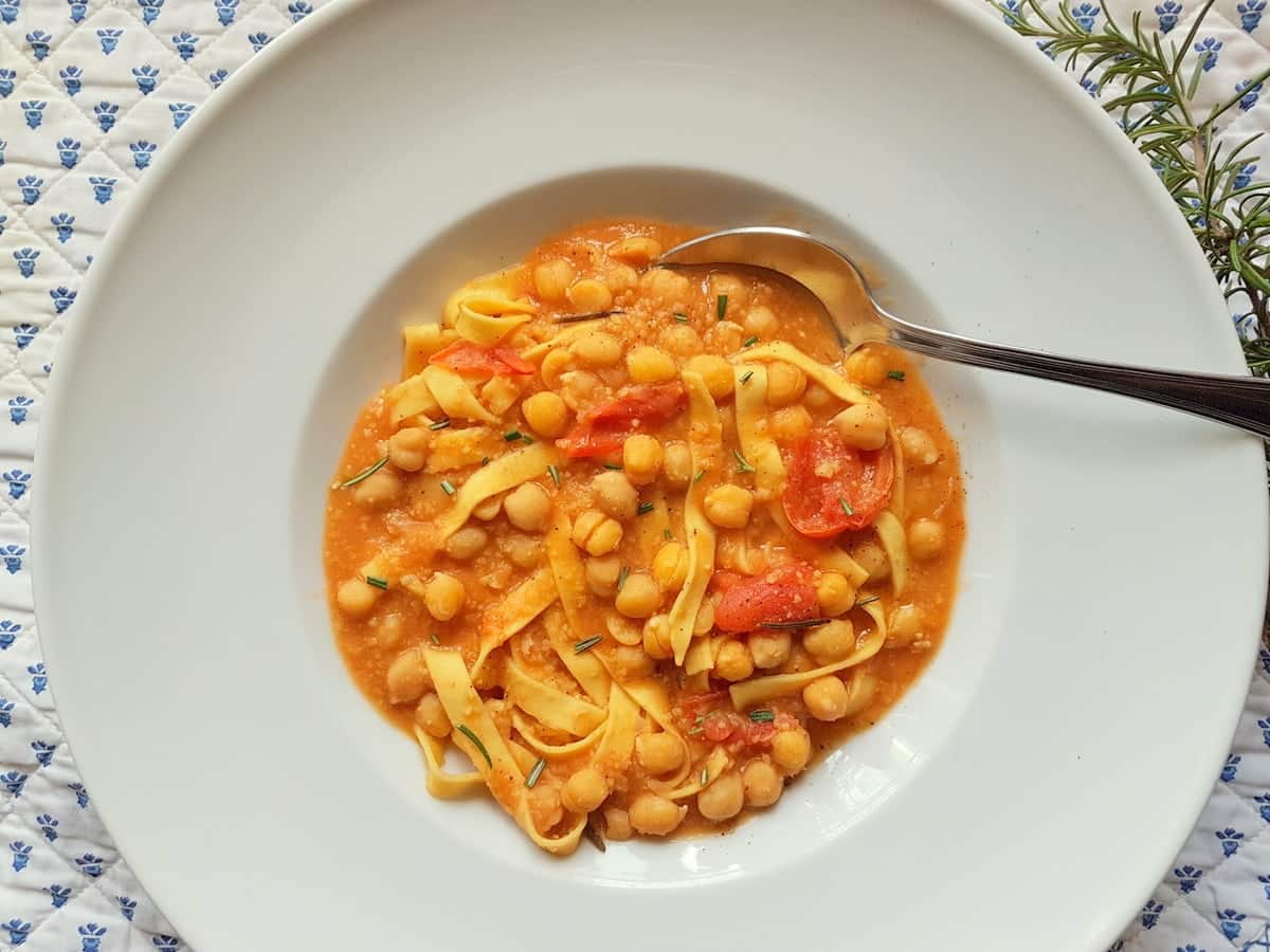 Tagliatelle with chickpea soup in bowl.