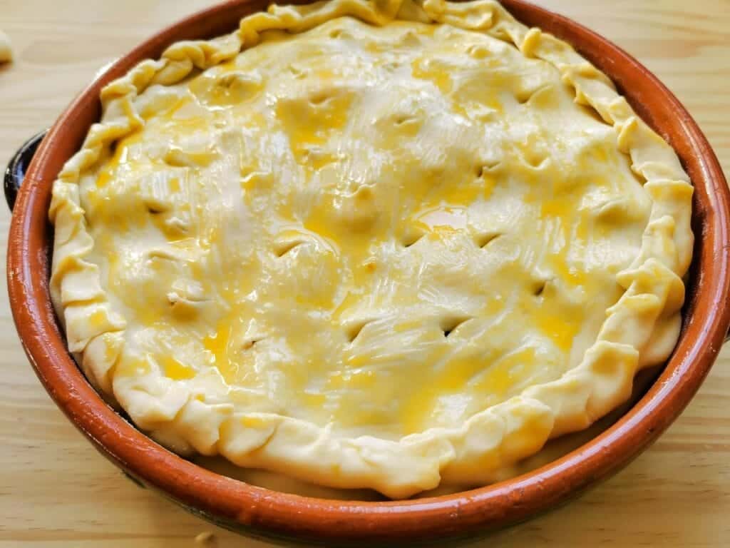 pasta pie with pastry ready to go in the oven