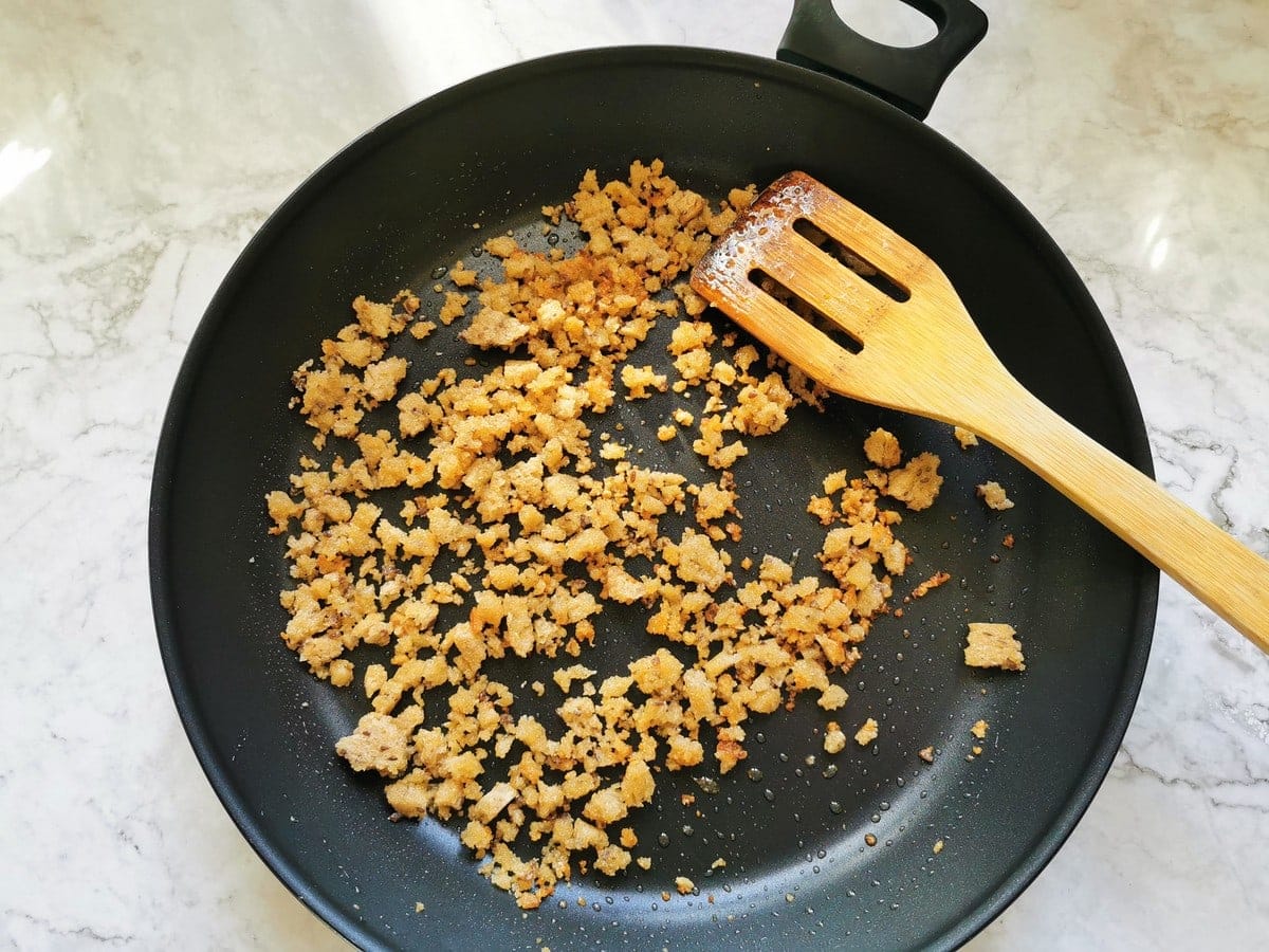 Golden and crispy homemade breadcrumbs in skillet.