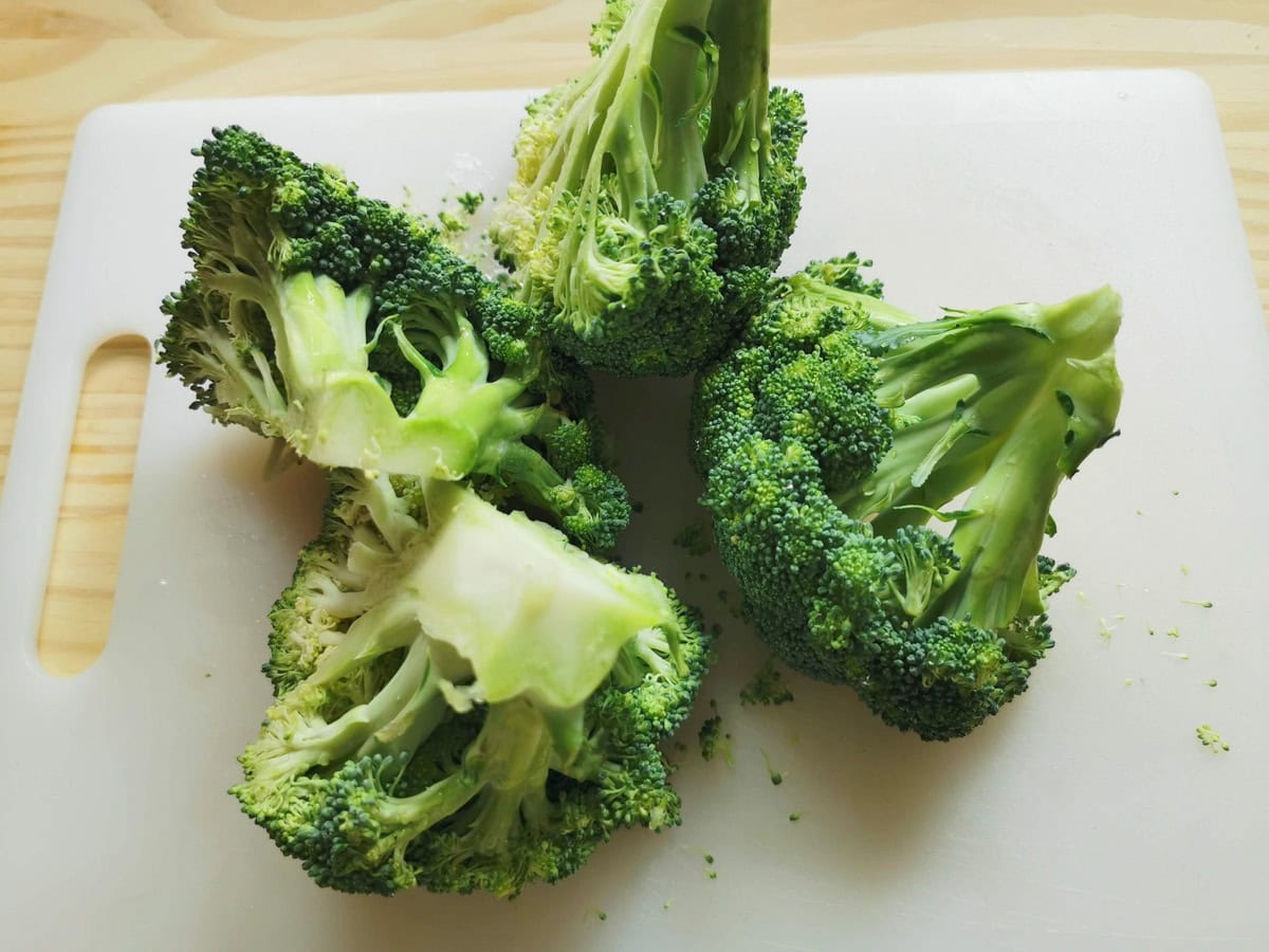 A head of broccoli cut into 4 pieces.