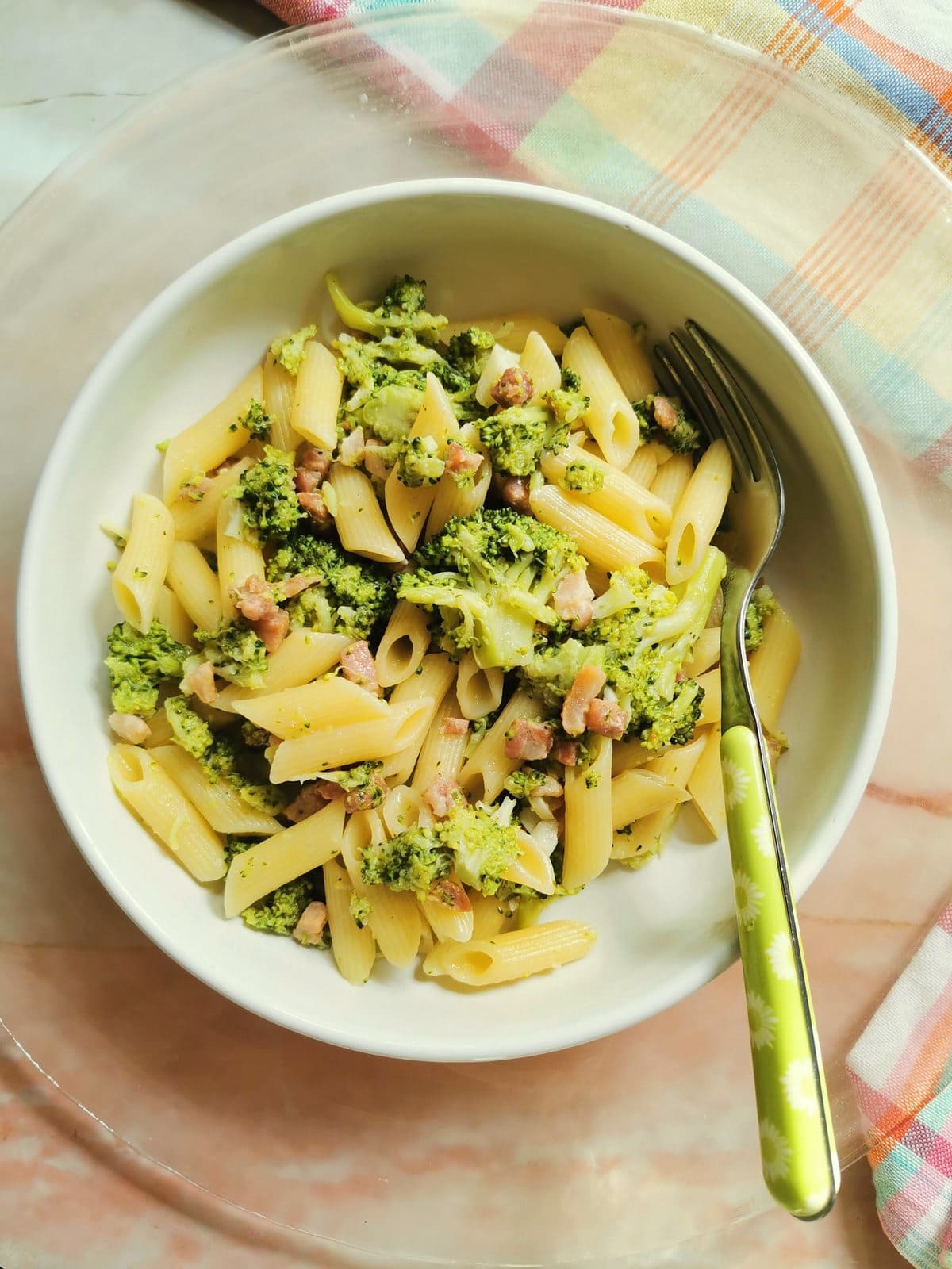 Penne pasta with broccoli and pancetta.
