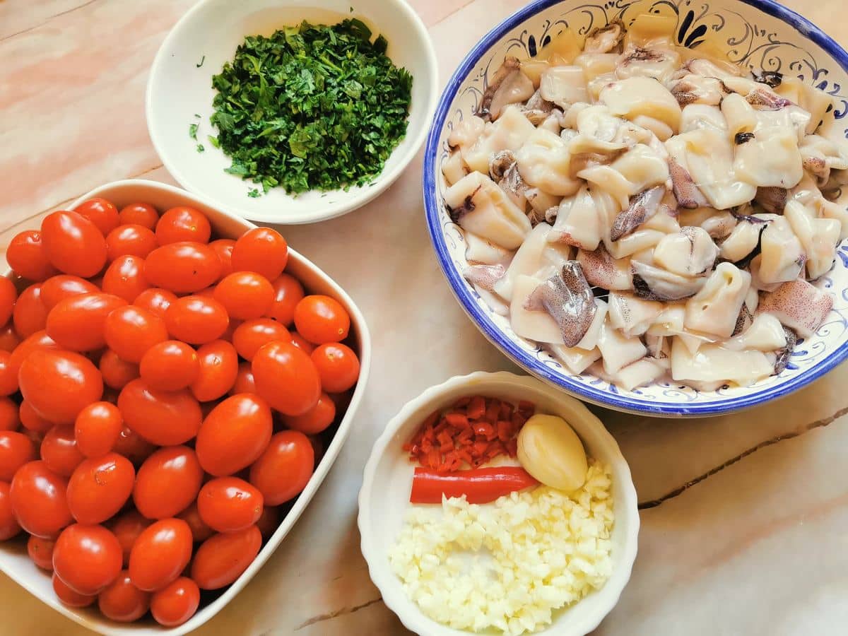 Ingredients for calamari pasta in bowls