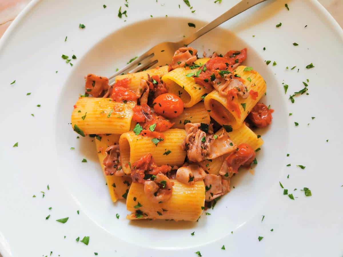 Valentine's Day pasta with calamari and tomatoes.