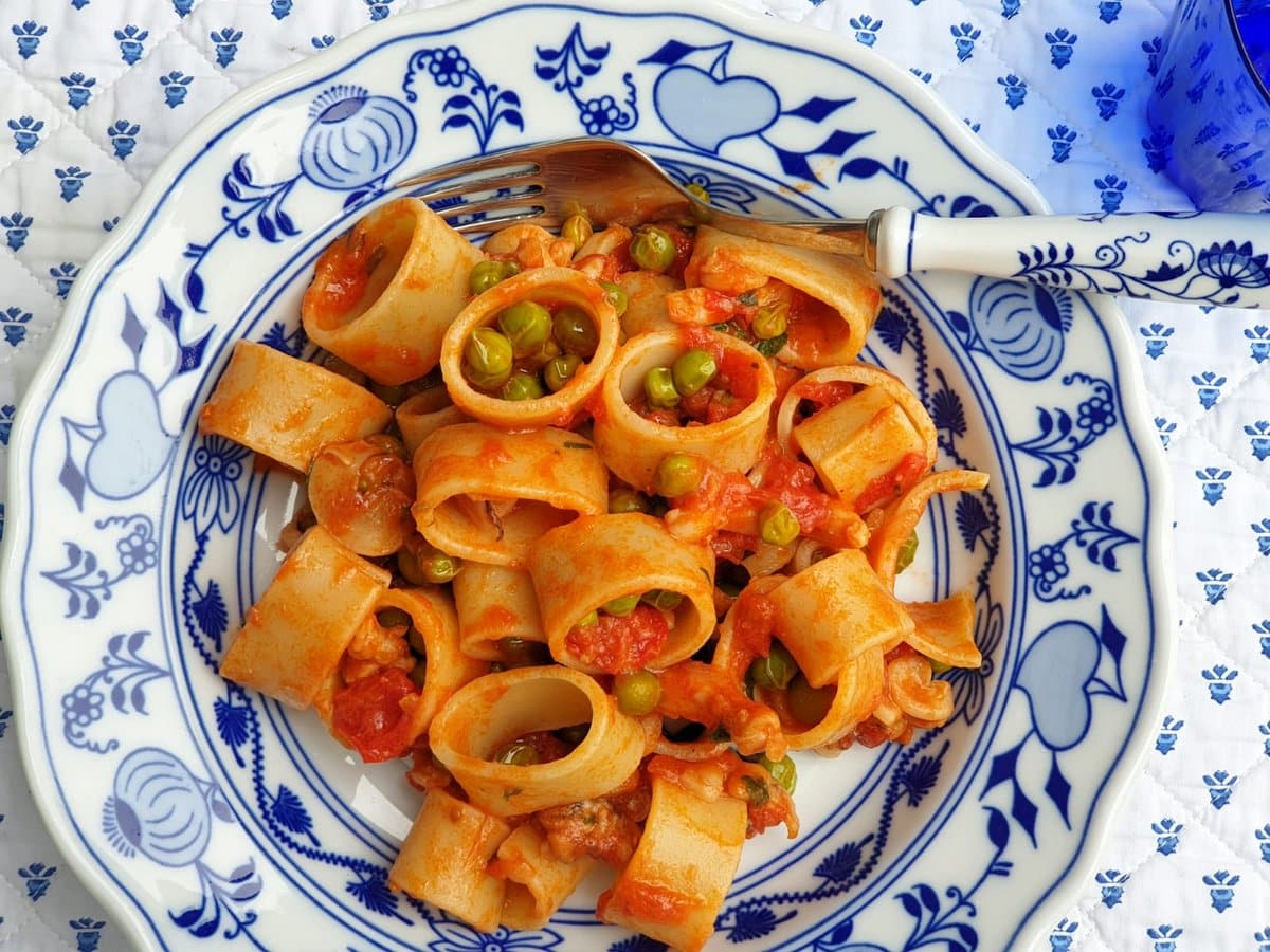 Pasta with cuttlefish and peas.