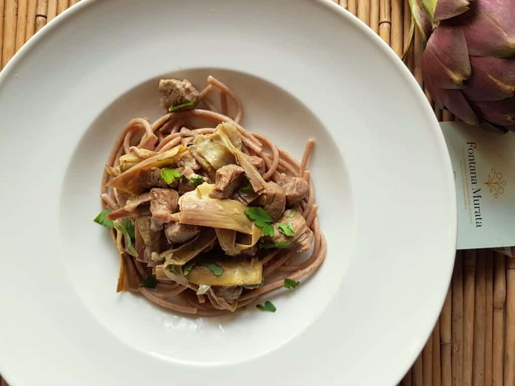 Wholewheat pasta with lamb and artichokes.
