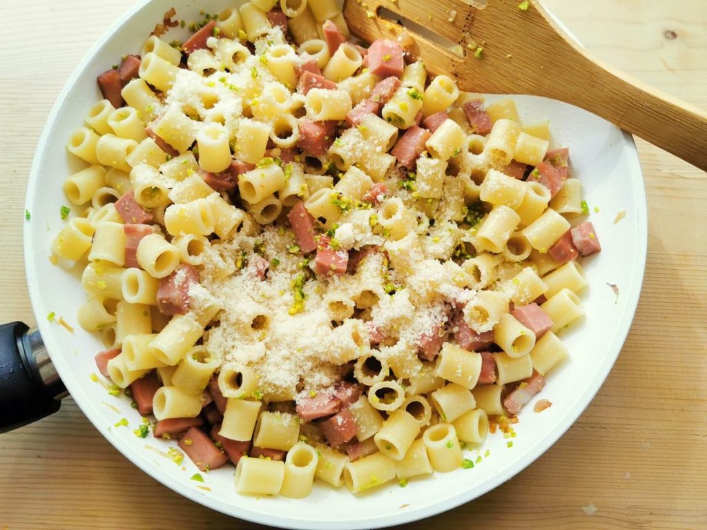 pasta with mortadella and pistachios in a pan