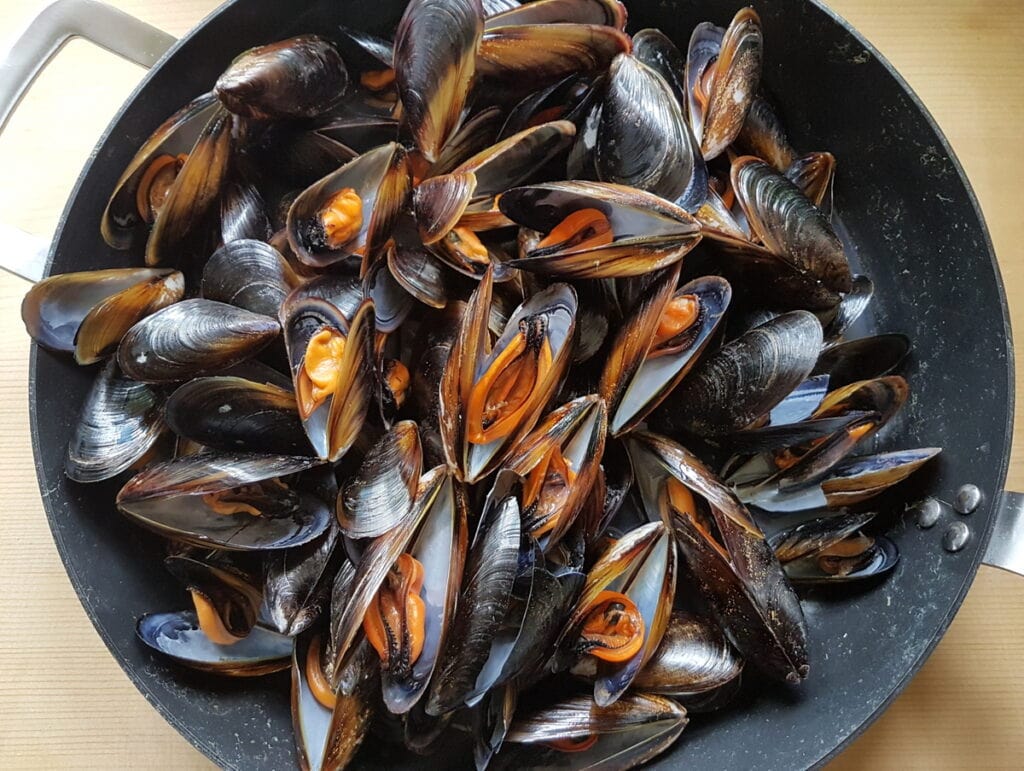 mussels cooking in skillet