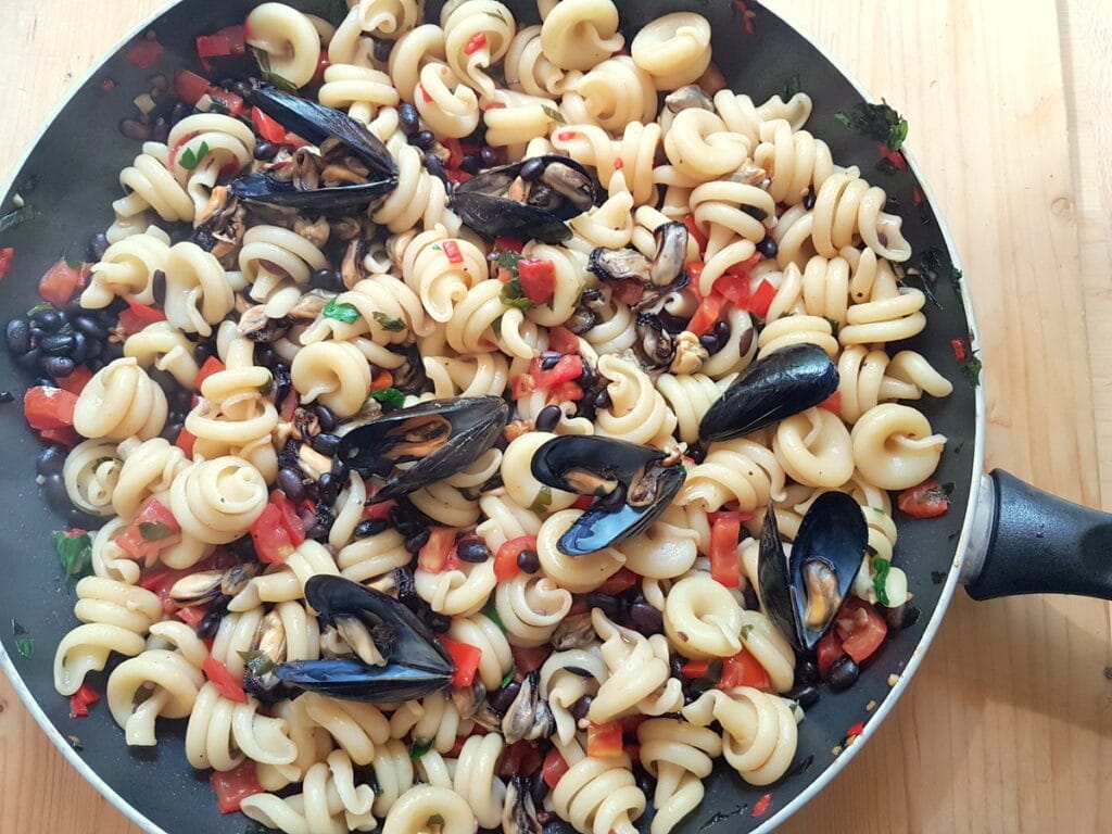 vesuvio pasta with mussels and beans in a pan