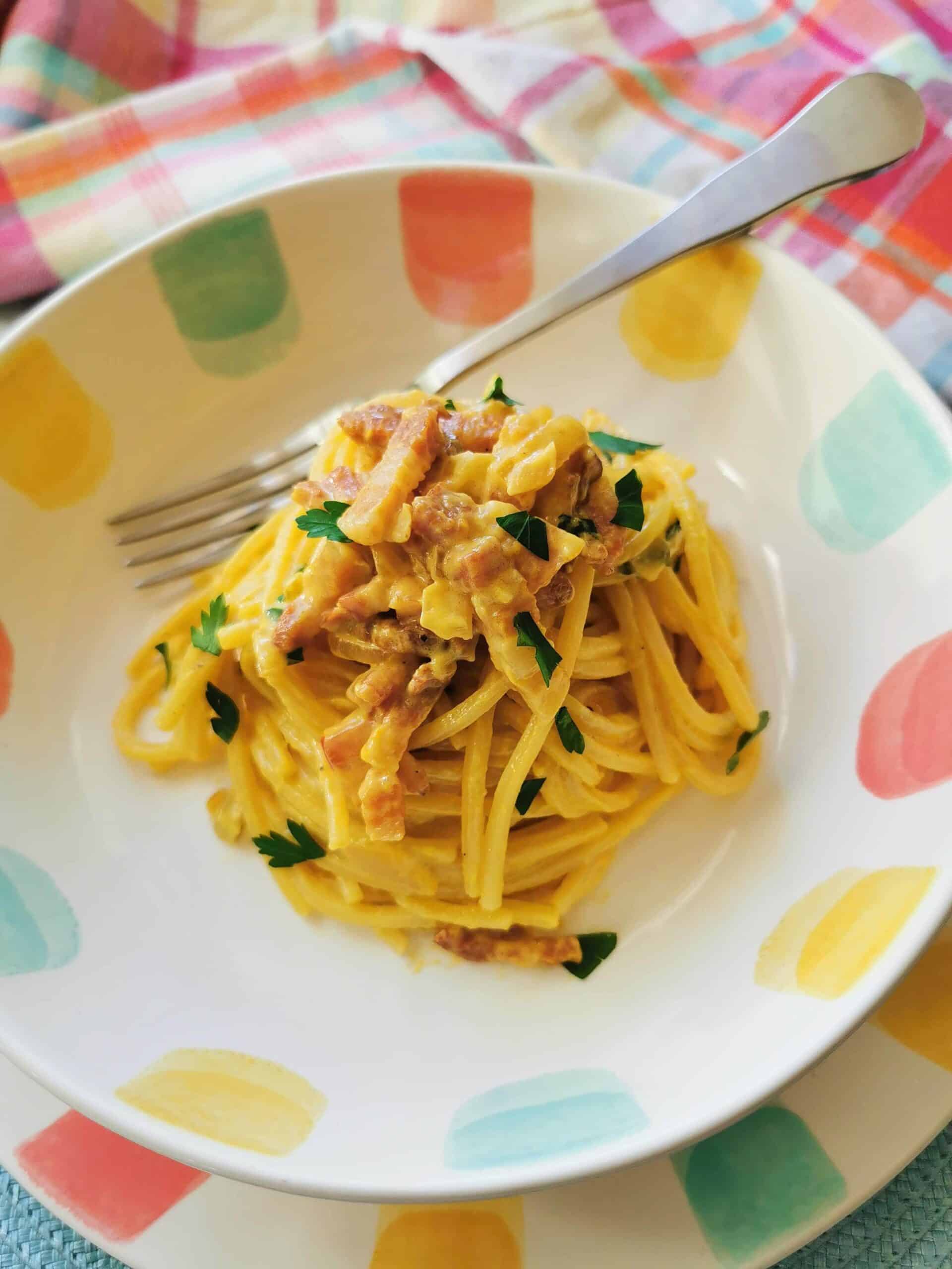 Pasta with saffron in a bowl garnished with parsley