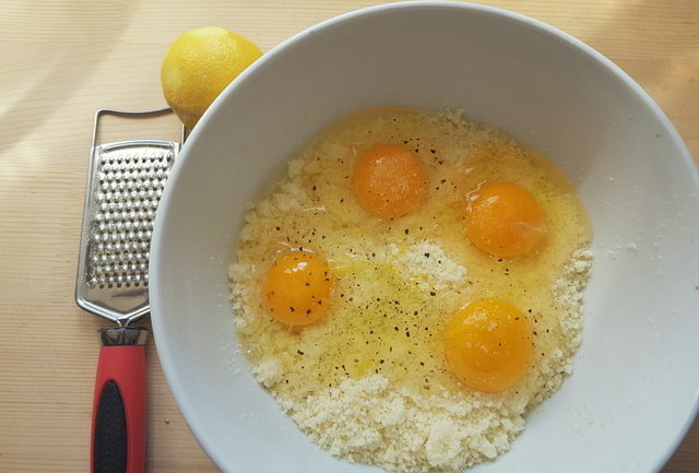 eggs and grated pecorino in white bowl