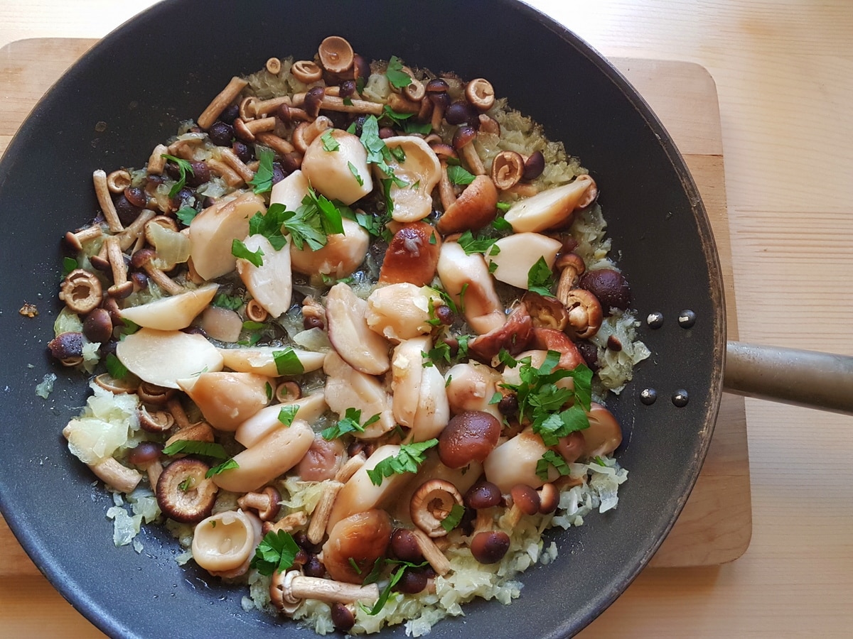 mushrooms, onions and parsley in skillet