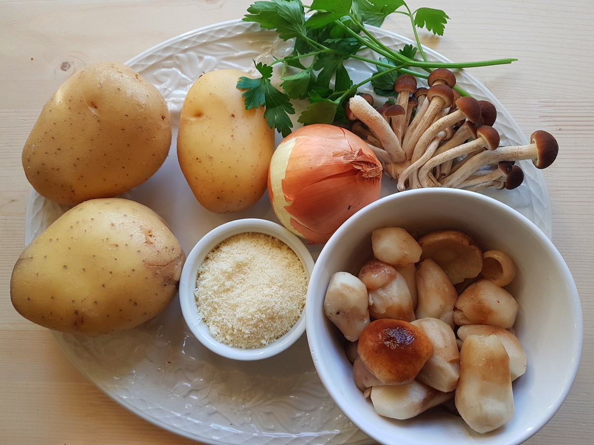 ingredients for potato and porcini cannelloni (manicotti) on white plate