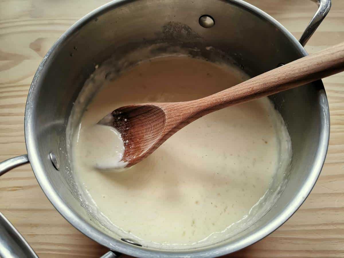 Castelmagno cheese sauce in large saucepan.