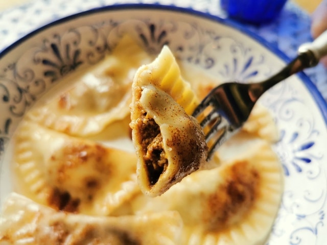 close up of halved prune and fig cjarson (sweet ravioli)