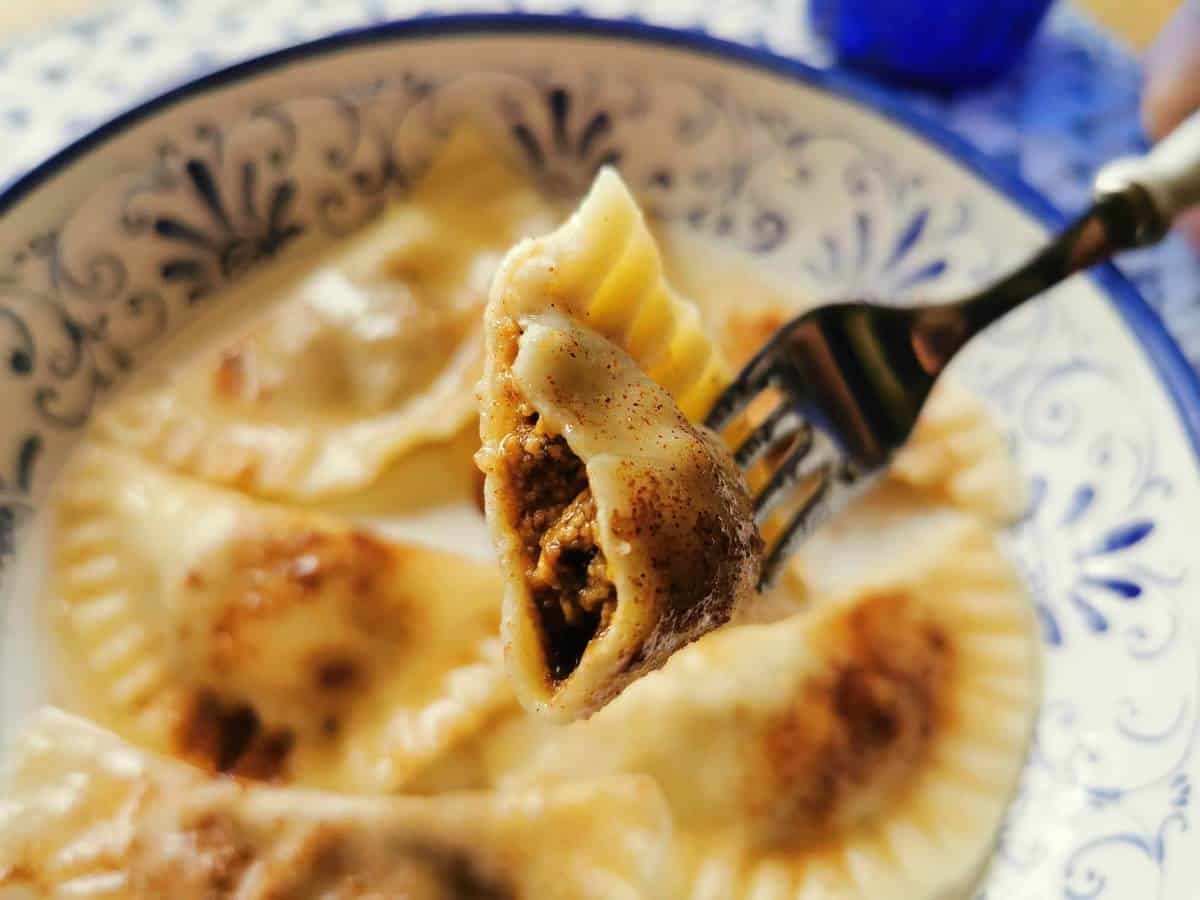 Sweet ravioli with butter, sugar and cinnamon chopped in half.