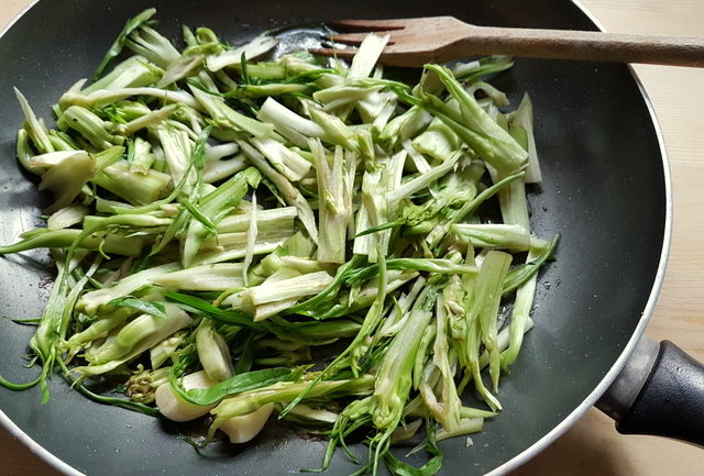 puntarelle cooking in frying pan