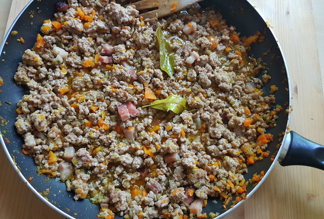 white ragu cooking in frying pan