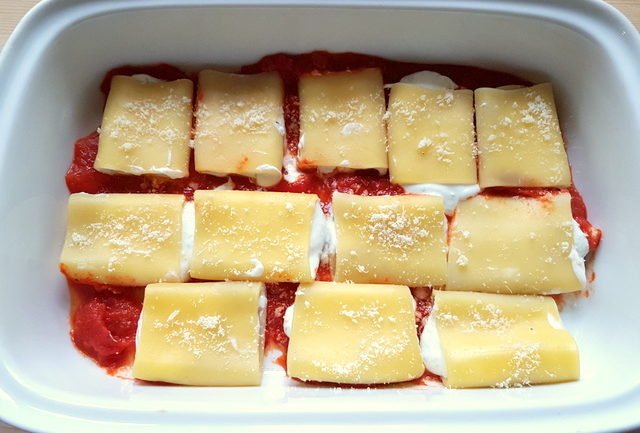 ricotta and basil filled paccheri pasta with homemade tomato sauce 