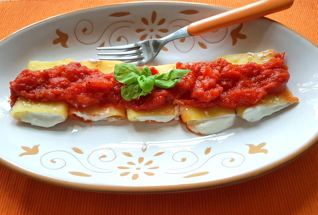 ricotta and basil filled paccheri pasta with homemade tomato sauce