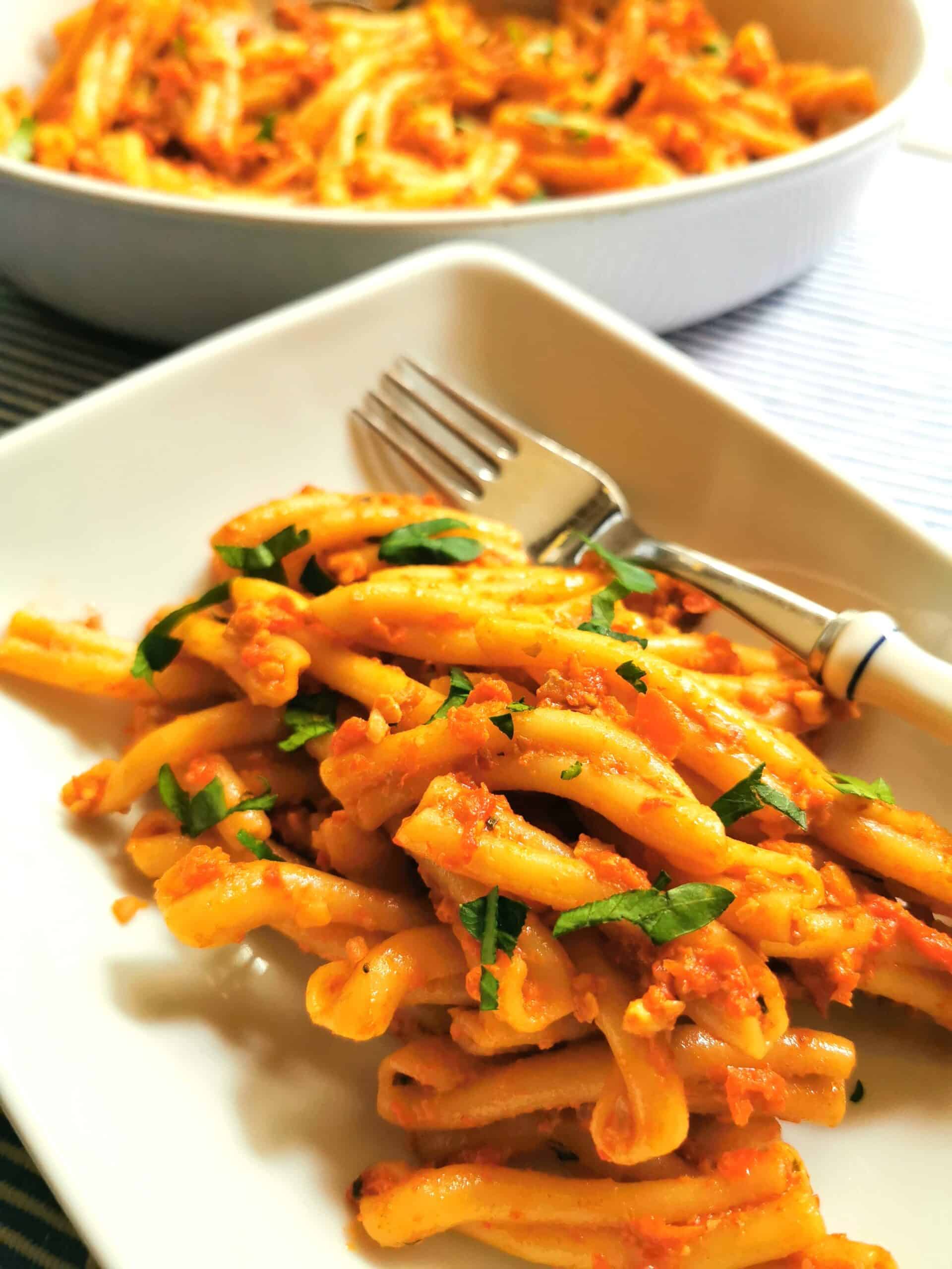 Roasted red pepper pesto with pasta in a bowl.