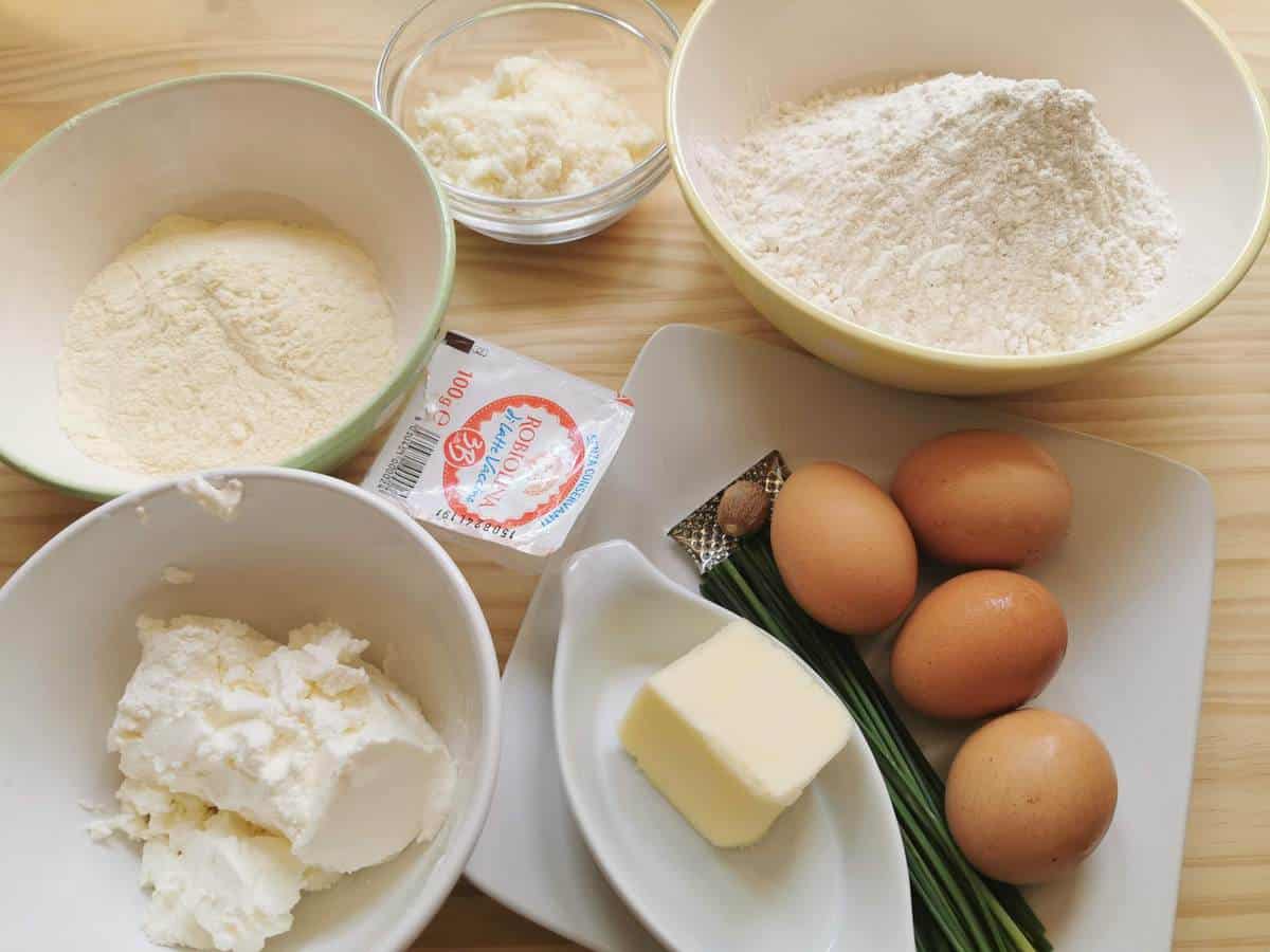 Ingredients for robiola cheese ravioli on wood work surface.