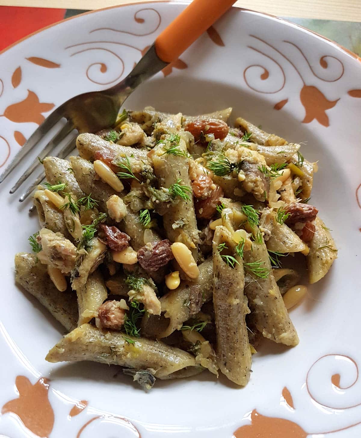 Sardine pasta garnished with fresh wild fennel