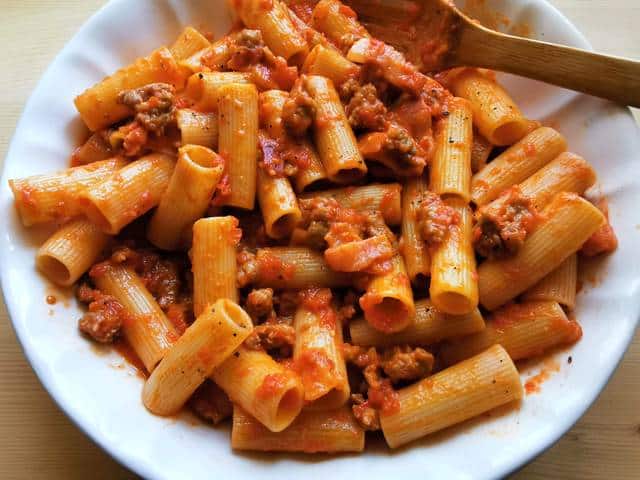 sausage rigatoni alla zozzona in white bowl ready to serve