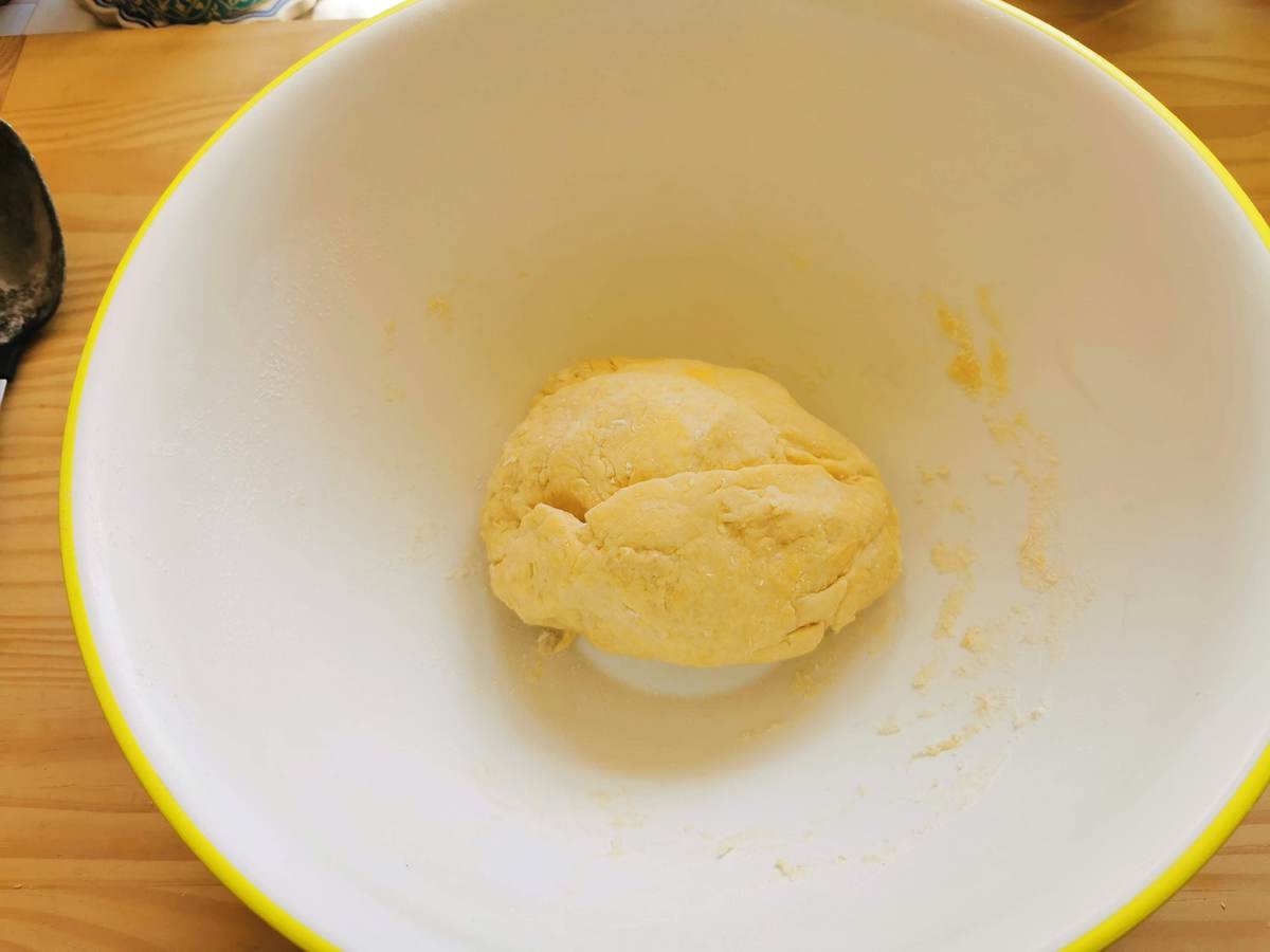 Ball of scarpinocc dough in a large bowl.