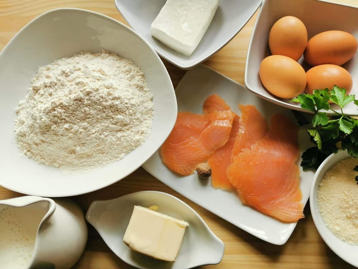 Ingredients for smoked salmon rosettes with homemade pasta on wood work surface.