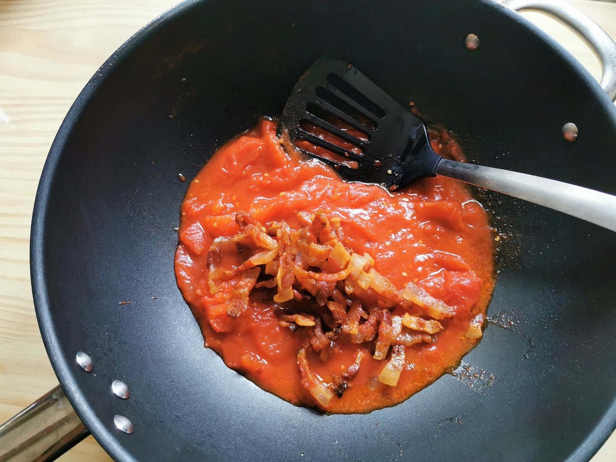 Crispy guanciale added to the tomatoes.