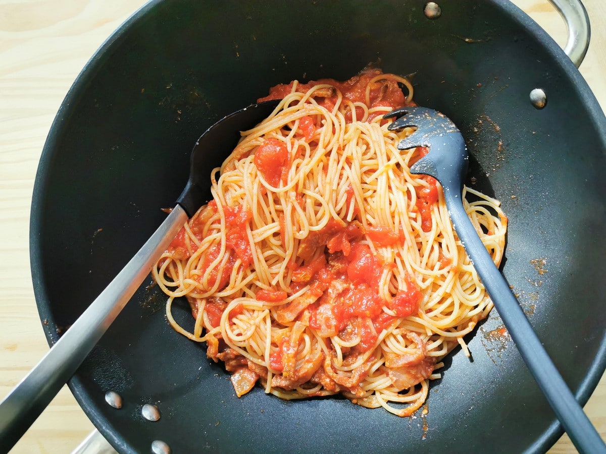 Pasta with amatriciana in a large pan.
