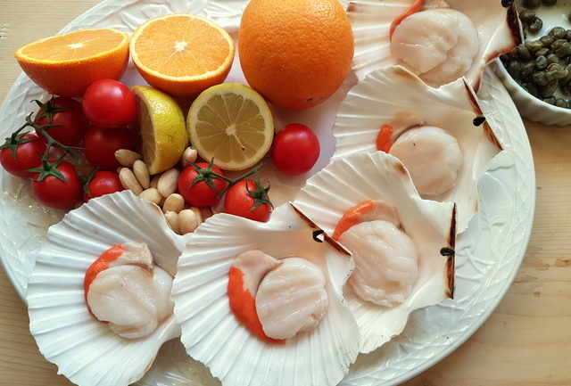 ingredients for spaghetti with scallops and citrus fruit; Italian recipe