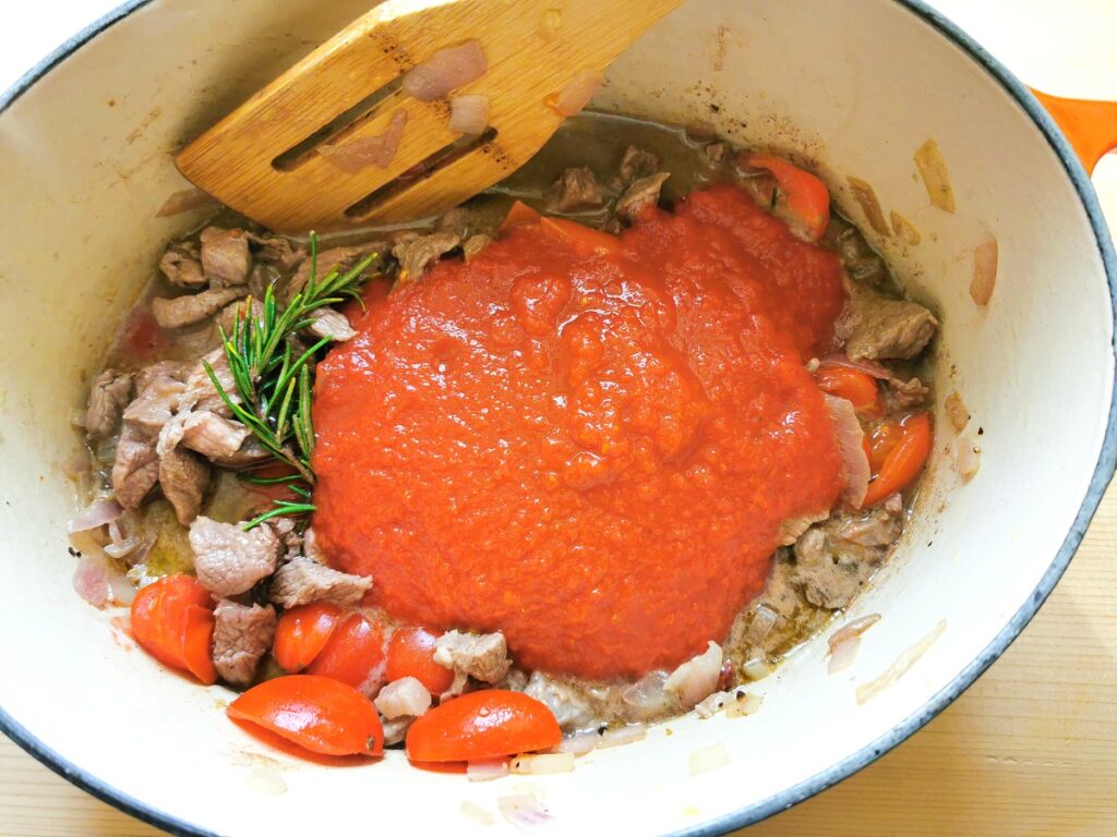 Tomato passata added to the pot