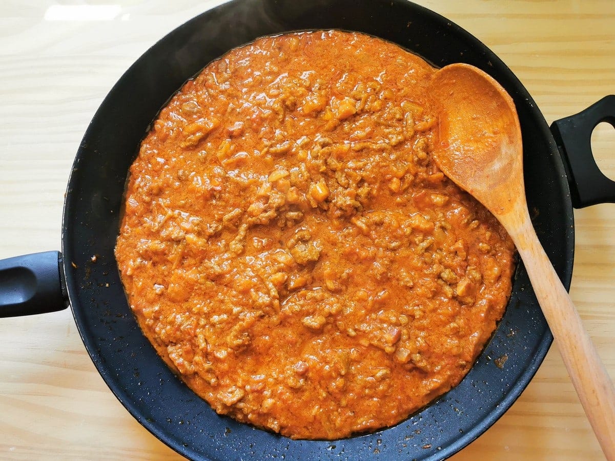 Bolognese sauce in frying pan that is ready to add pasta.