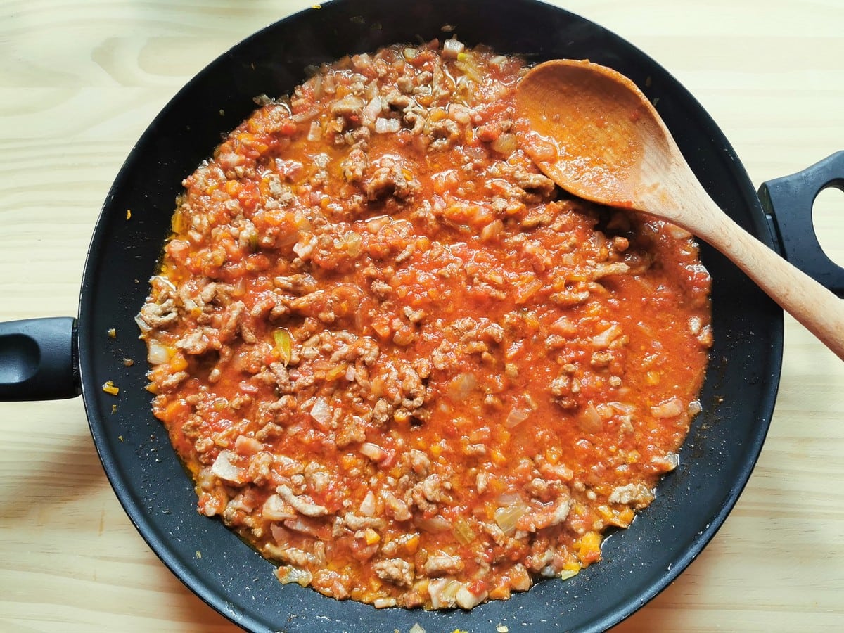 Bolognese sauce in frying pan before adding the milk