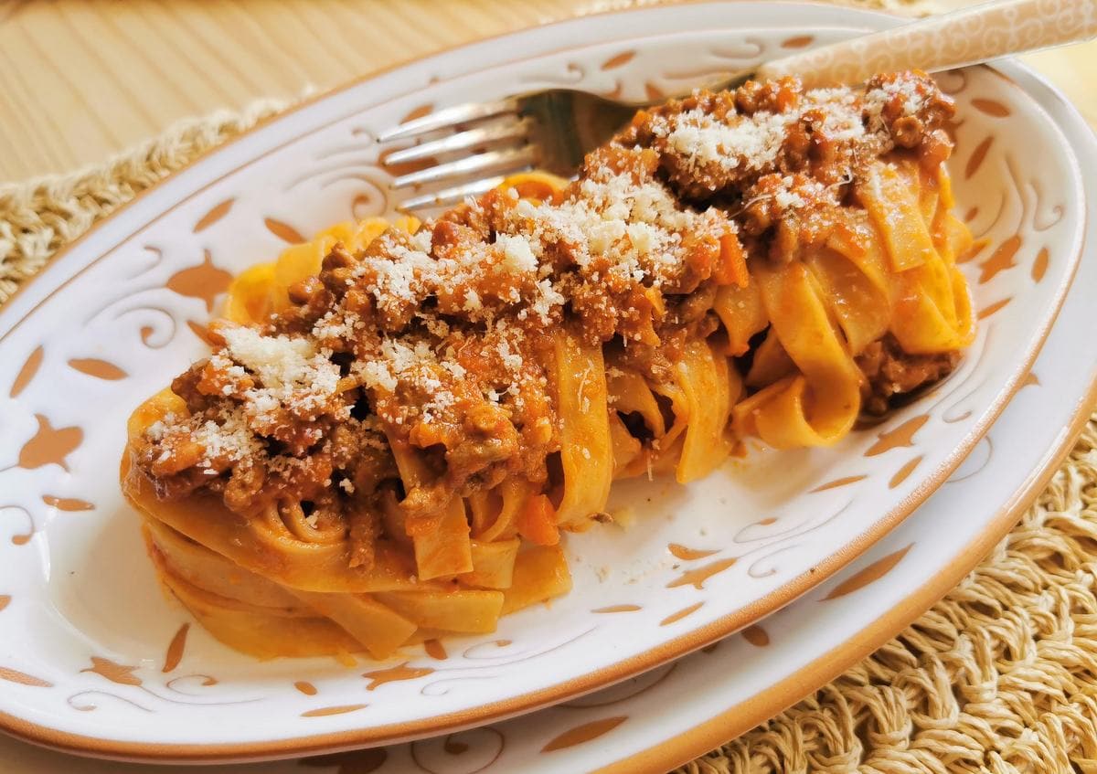 Tagliatelle bolognese with parmigiano reggiano.