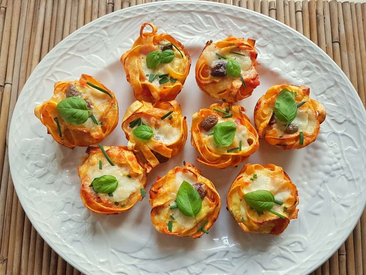 Baked tagliatelle pasta muffin nests.