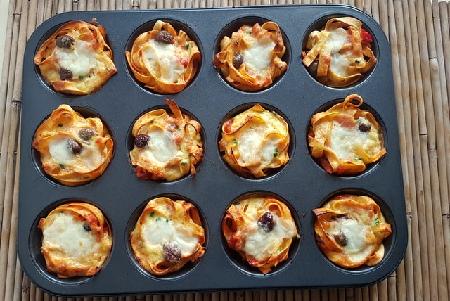 tagliatelle pasta muffin nests in muffin tin after baking