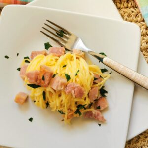 tagliolini au gratin with ham and cream