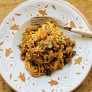 tagliolini pasta alla langarola with sausage in a bowl