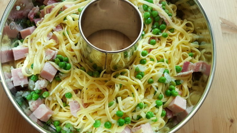 ingredients in ring cake tin for tagliolini pasta pie (crostata) 