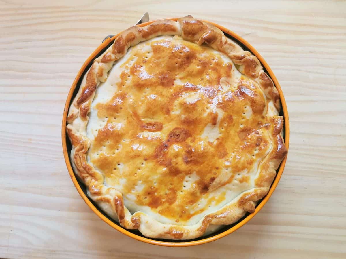 ready baked tortellini pie in spring form cake tin.