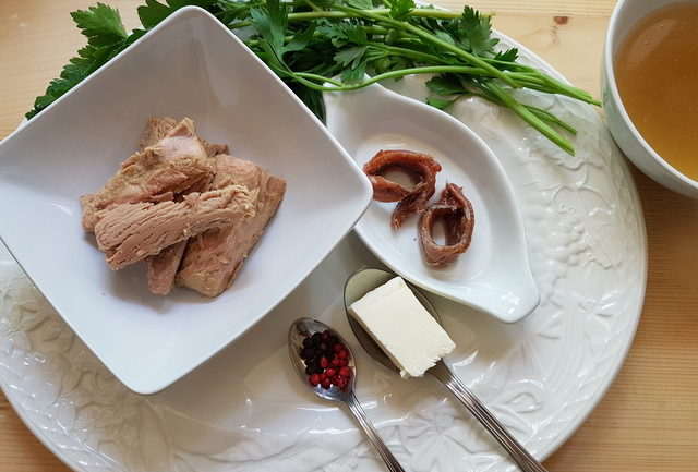 ingredients for tuna and anchovy vermicelli on white plate