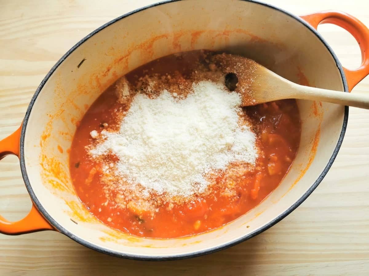 grated pecorino cheese added tolardo sauce in Dutch oven