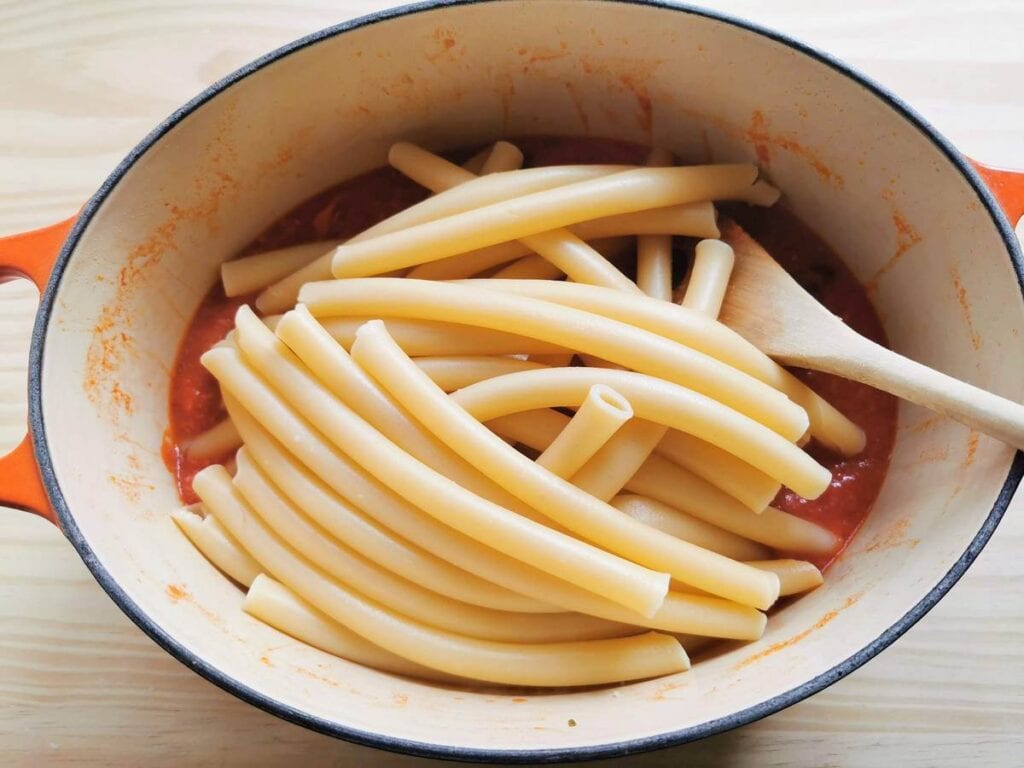 Cooked zitoni in Dutch oven with lardo sauce